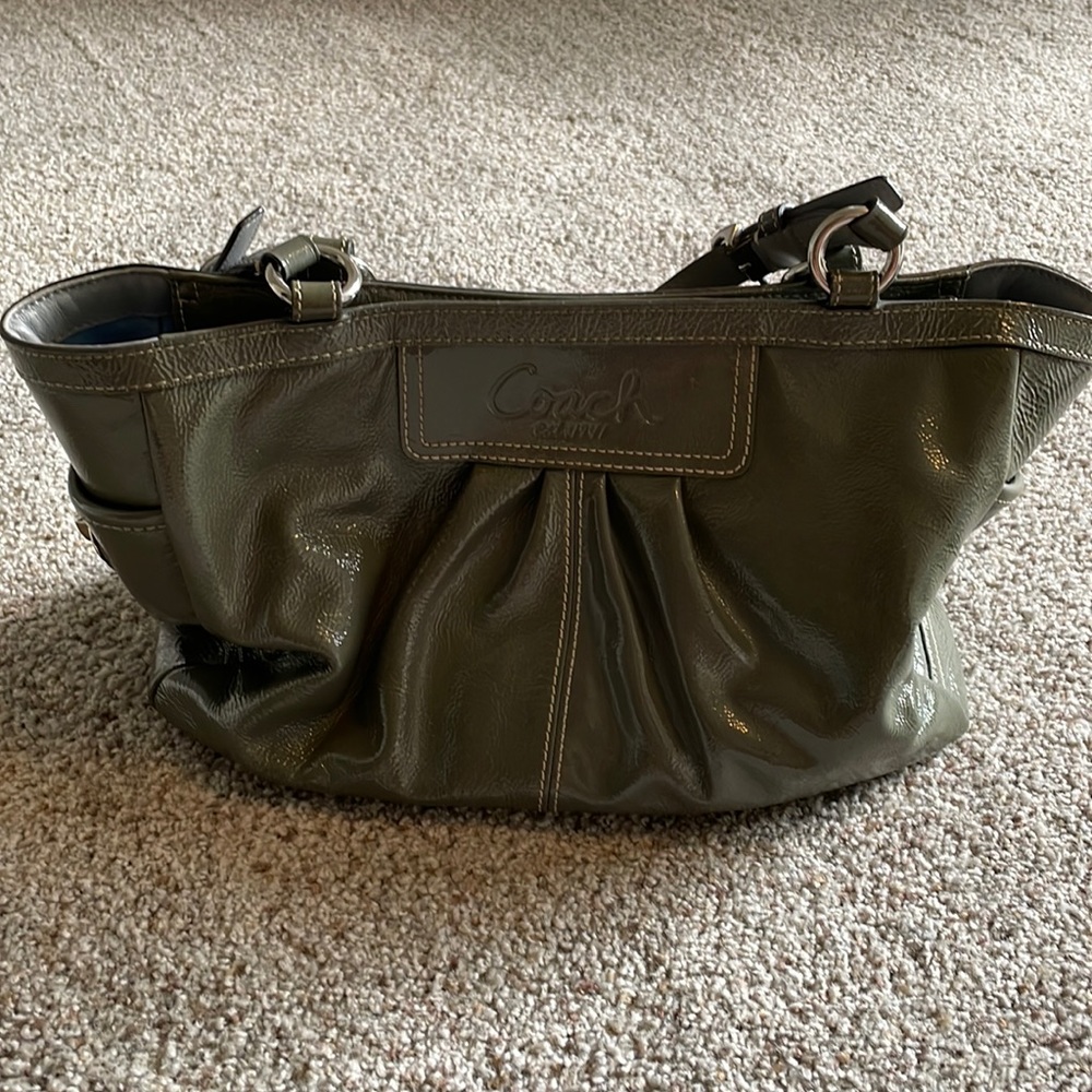 Coach shiny leather gray hand bag w/short double strap. Lots of pockets inside